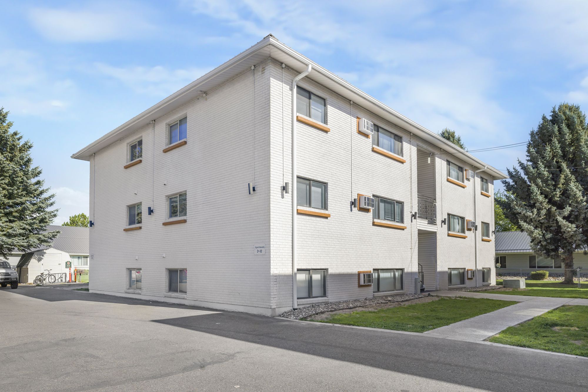 The Strawberry apartments, white brick exterior, Rexburg Idaho